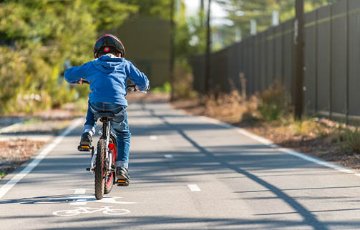 Child on a bike path